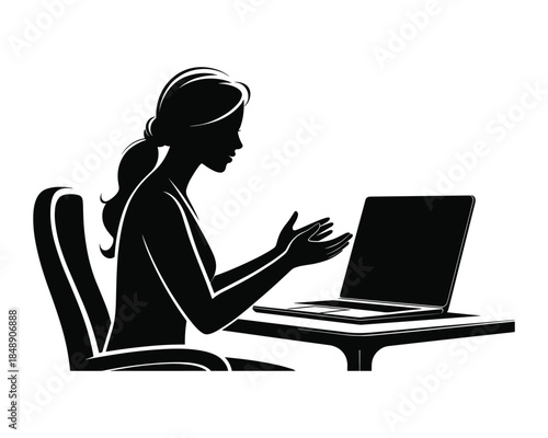 Woman Working on Laptop at Office Desk