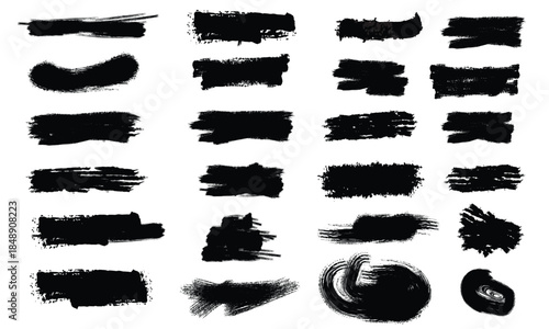 Collection of black brush strokes and marks on white background