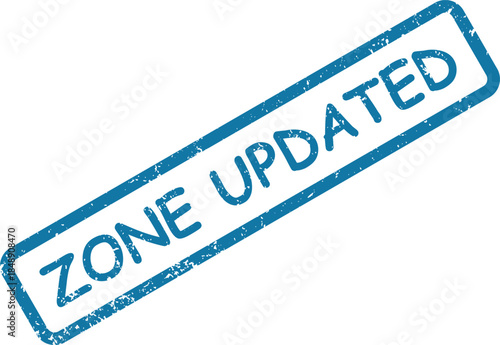 Blue rubber stamp impression showing the words ZONE UPDATED on a white surface