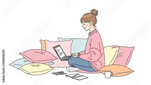 A young woman comfortably working on her laptop while sitting on the floor surrounded by colorful pillows.