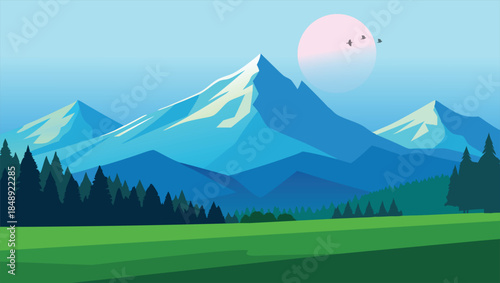 Majestic blue mountains covered in snow with green forest and meadow under clear sky