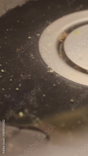 Clogged sink drain with waste water stuck close-up