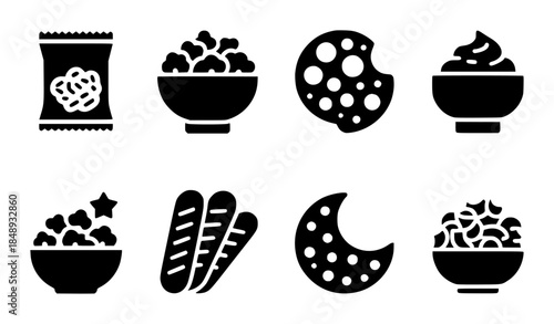 Black snack food in flat including popcorn chips and vegetables cracker