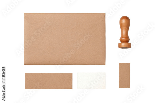 Stationery Essentials: A top-down perspective captures the timeless elegance of essential stationery supplies, arranged for a touch of rustic charm. Envelopes and a stamp.