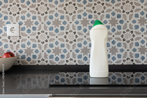 All-Purpose surface cleaner bottle mockup on induction cooktop in modern kitchen
