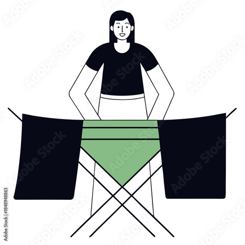 Woman cheerfully hanging wet laundry on a drying rack in a cozy home environment