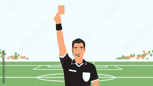 Stern Soccer Referee Showing a Red Card on a Green Football Field