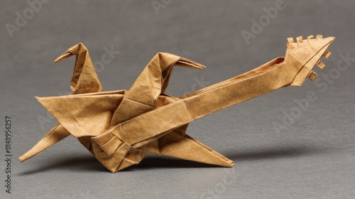 Origami crane and guitar sculpture brown paper on gray background