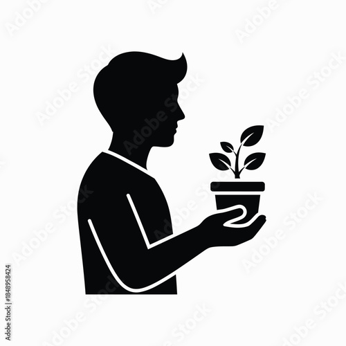 Person holding potted plant