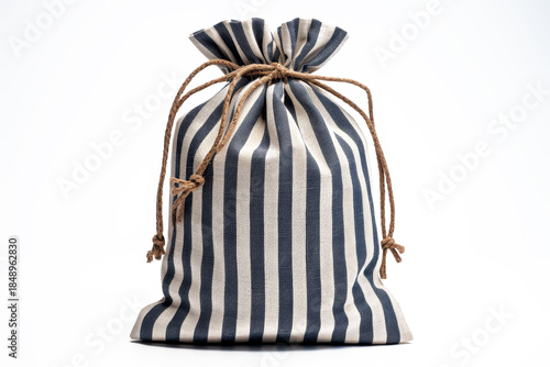 Nautical navy and cream striped gift fabric bag on white background, empty space