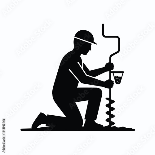 Worker operating drilling equipment