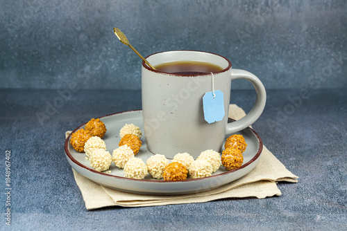 Cup of tea and candies