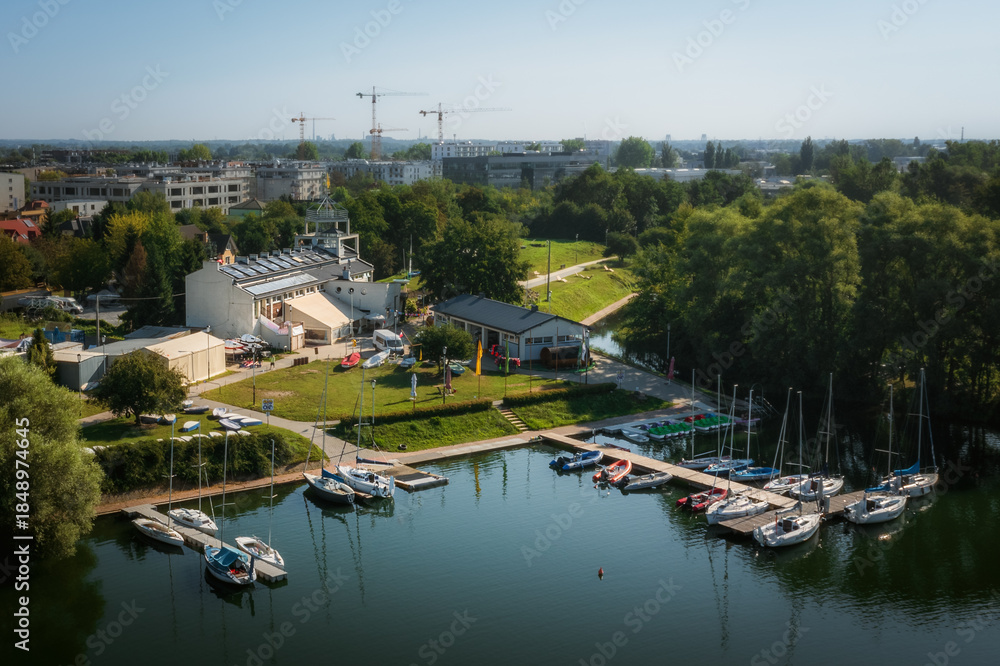 Fototapeta premium Small marina over Bagry lake in Krakow, Poland at Summer time. Morning, soft lighted.
