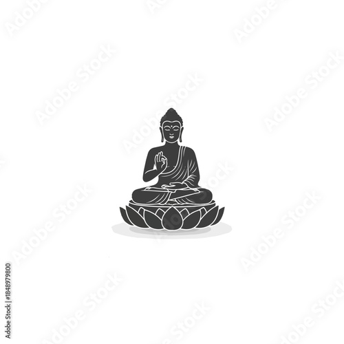 Buddha statue in meditative lotus pose.