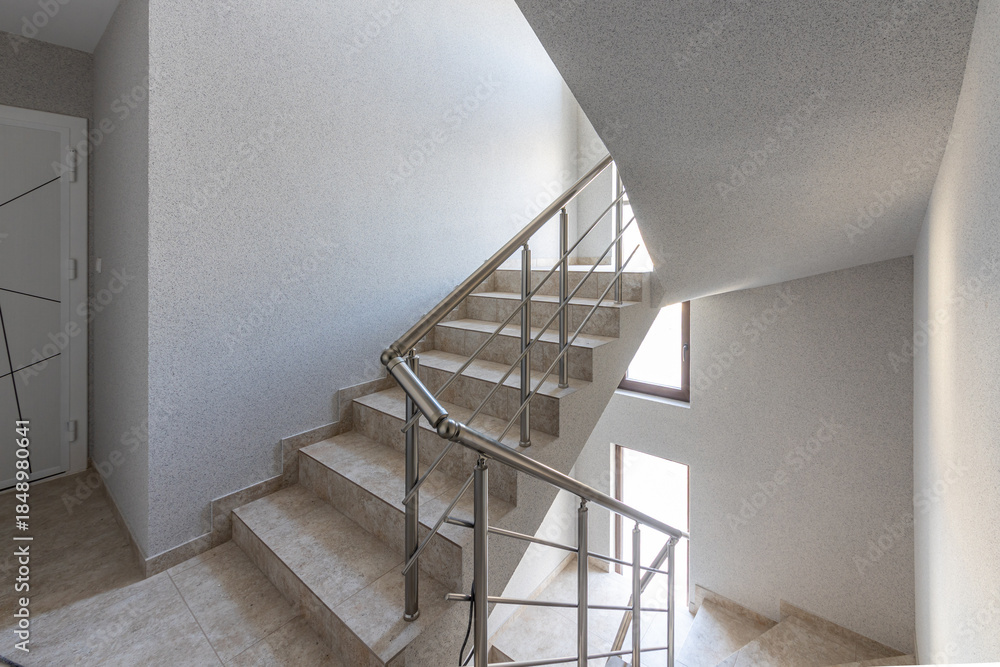 custom made wallpaper toronto digitalModern stair case between floors. Stairs with metallic rail in modern building. Interior of a contemporary apartment or office building. Architecture and real estate background.