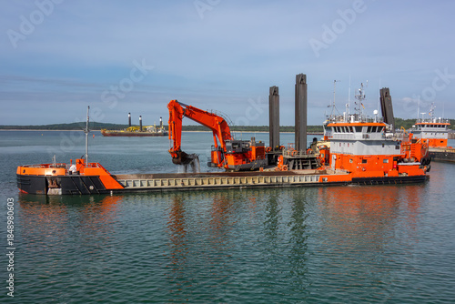 Wallpaper Mural Large Dredging Vessel with Excavator Working in Harbor. Marine Construction Barge Performing Seabed Dredging for Port Development and Industrial Waterfront Projects Torontodigital.ca