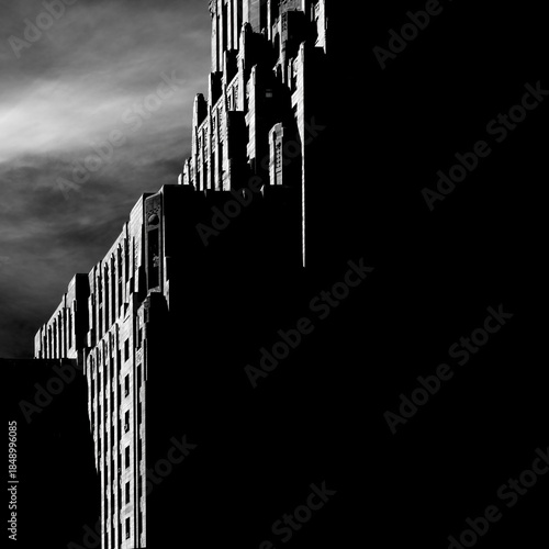 buffalo, new york city hall art deco building is classical architecture in dramatic glancing light and lines with large black area for copy