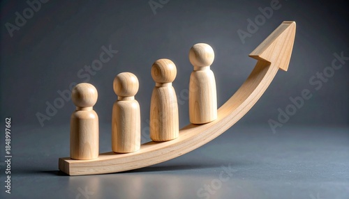Wooden peg people standing on a rising wooden arrow representing career progression team growth and upward business momentum