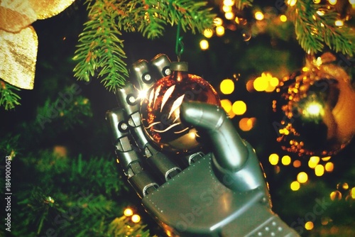 Futuristic Christmas tree with a humanoid robot hand holding a shiny and glitter futuristic black ornament with blue light and circuit print putting it on the Christmas tree.