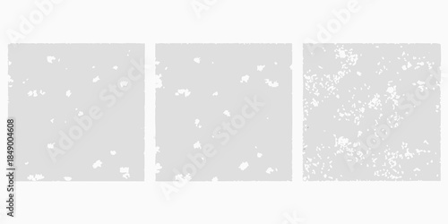 Three grayscale rectangular panels with varying degrees of speckled texture
