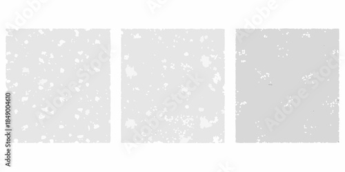 Three rectangular panels with a distressed speckled and textured gray surface