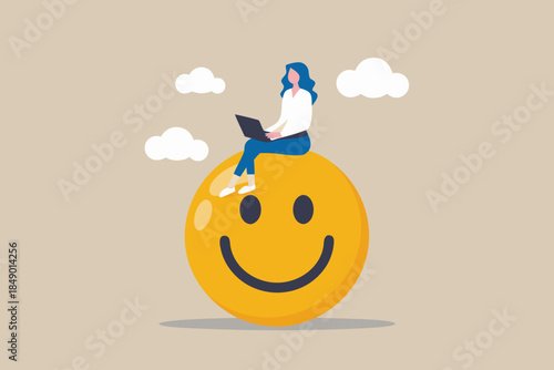 Woman working on laptop atop a large yellow smiley face in the clouds