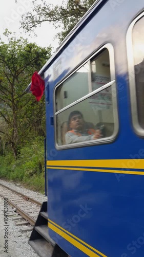 Moving Blue PeruRail Train in the Andes