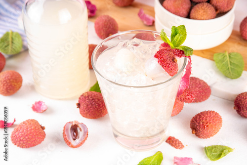 Wallpaper Mural Lychee fruit tasty margarita or lemonade cocktail. Tasty alcohol drink with fresh lychees, mint leaves, liqueur and sweet sour juice, on white pink table background with ripe raw lychee fruits, copy s Torontodigital.ca