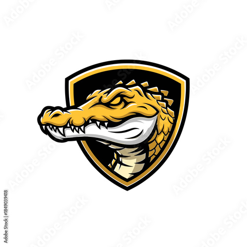 Illustration of a golden dragon's head with sharp teeth on a black and yellow shield against a white background.