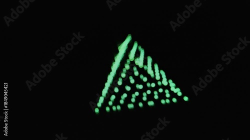 Colorful light patterns move in a space with different shapes and formations during the display in a dark setting at night