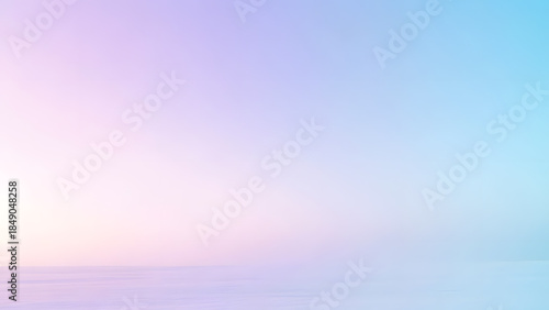 Fotografie Soft pastel gradient background transitioning from pink to light blue resembling a peaceful winter dawn or horizon