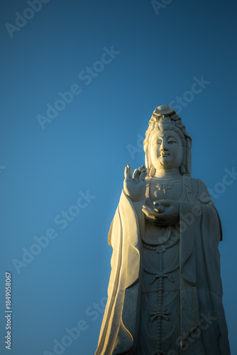 Guanyin Statue Against Clear Blue Sky