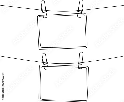 Blank signs hanging a clothesline with clothespins