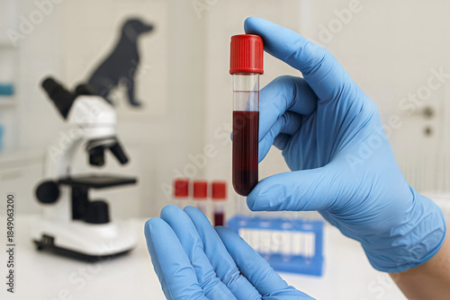 Vet holding blood test tube with microscope background AI generated