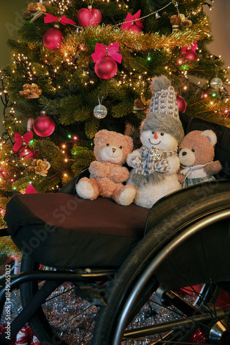 snowman and teddy bears in a wheelchair