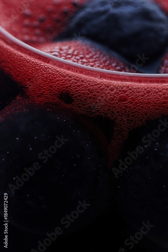 close up of bubbles red wine