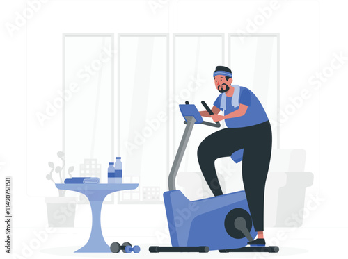 Man exercising on blue stationary bike in gym with table and dumbbells nearby exercise bike workout