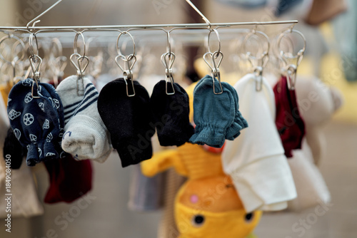 Baby clothes and accessories hanging