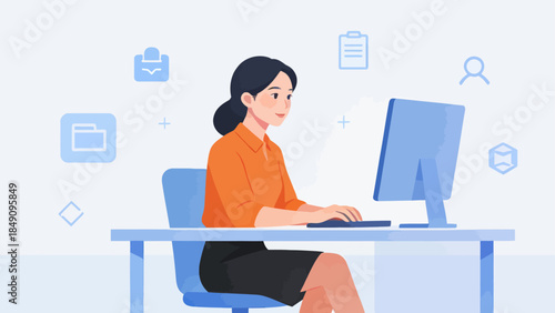 Woman working on computer at desk