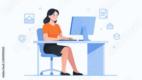 Woman working on computer at desk