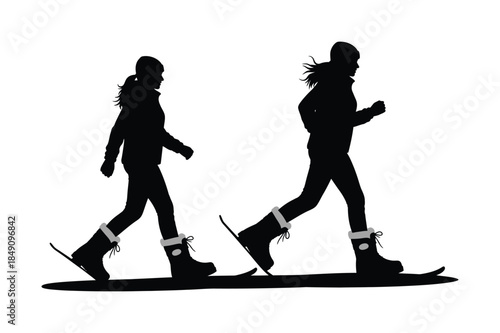 Silhouette of two people walking with snowshoes on a white background. Winter sports and outdoor activity.