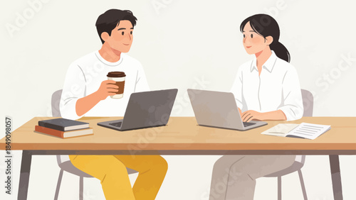 Two people working together on laptops