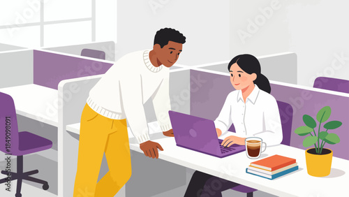 Office workers collaborating on laptop