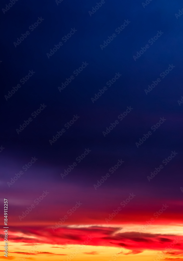 Fototapeta premium Sunset sky with vibrant colors and dramatic clouds – perfect nature background for commercial use. Abstract Orange Red Gradient