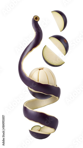 Spiral peel and sliced segments of purple mangosteen fruit isolated on white background, fresh tropical fruit close-up