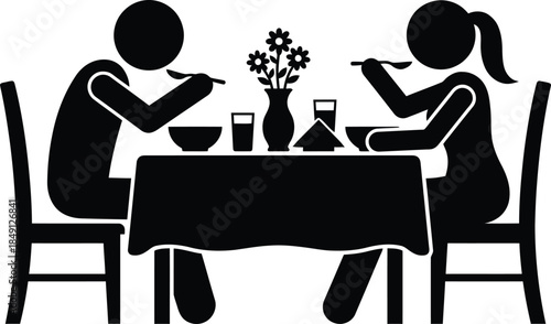 Couple enjoying a meal together at a dining table with flowers