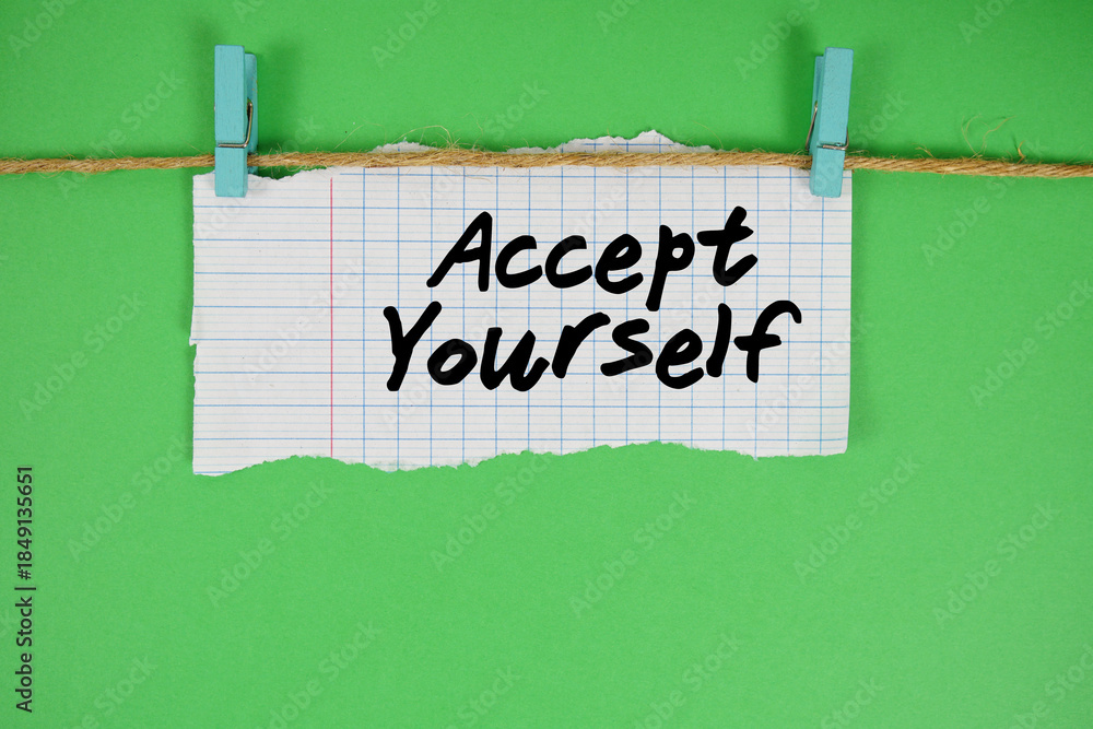 Fototapeta premium Accept Yourself text written on rip paper with wooden clip on green background