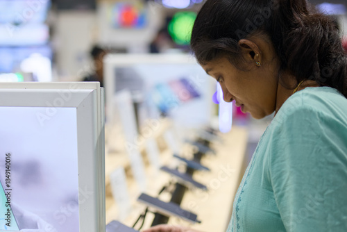 Woman shopping for tech products in store