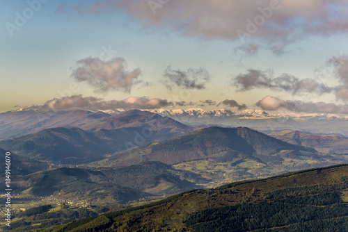 Panoramic view from Eretza mountain to Pico de la Cruz and Cantabria peaks, Lush green slopes