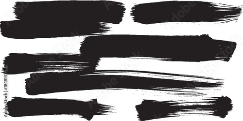 Set of various black ink brush strokes and paint smears for artistic design.
